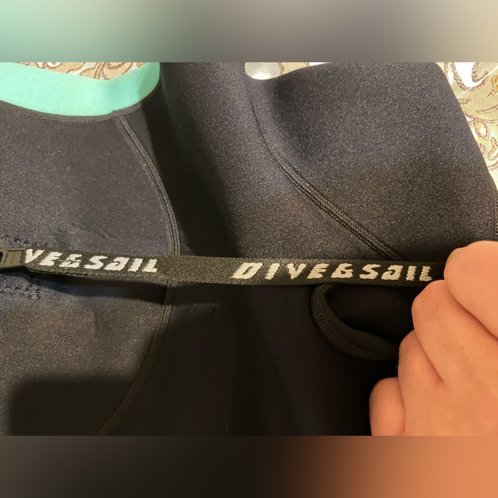 Two children’s full body wetsuits